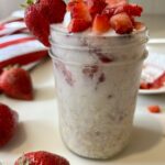 overnight oats with strawberries in a mason jar